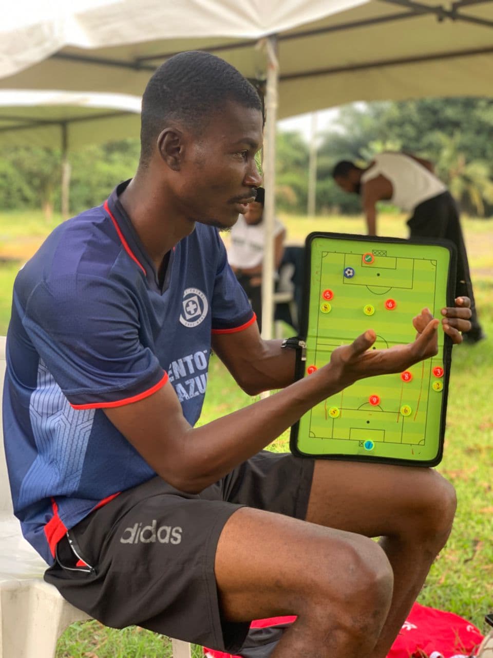 Coach explaining tactics on board