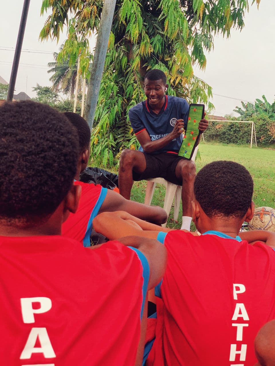 Pathfinder FA coach discussing tactics with players
