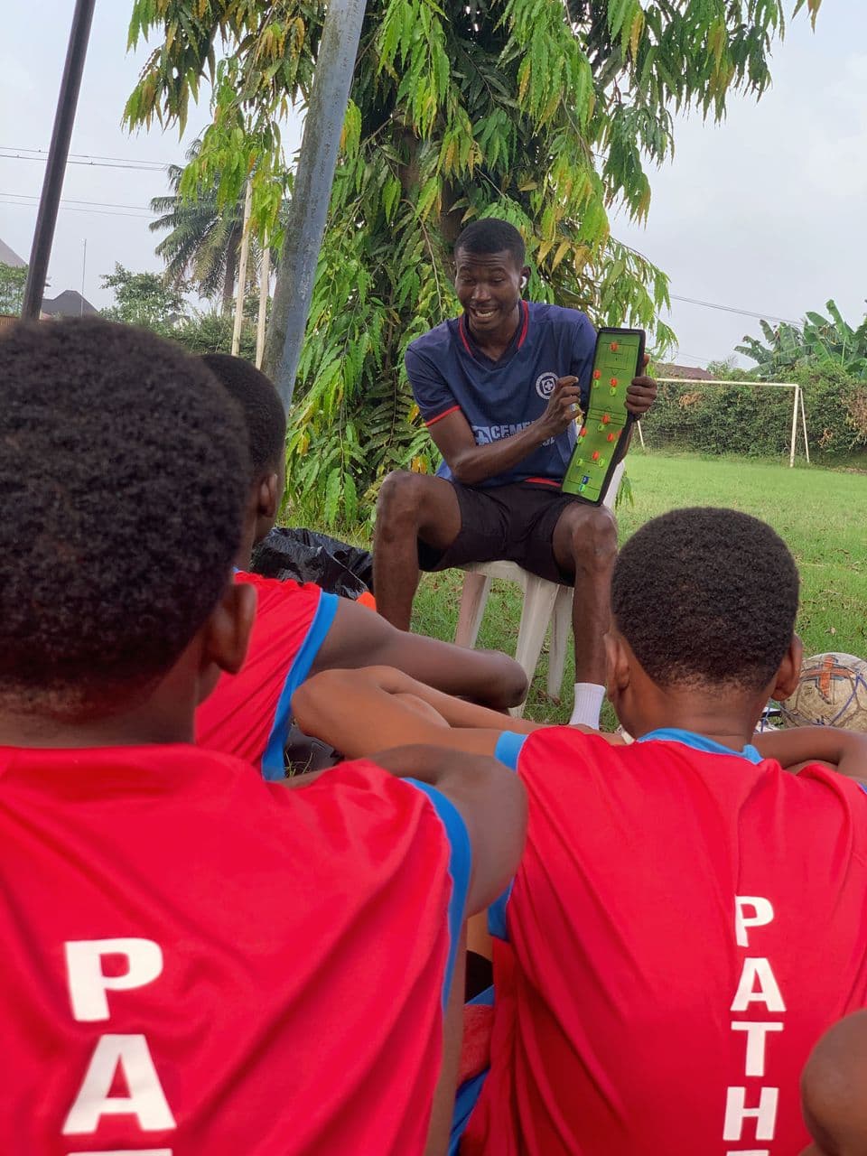 Coach teaching formations to players