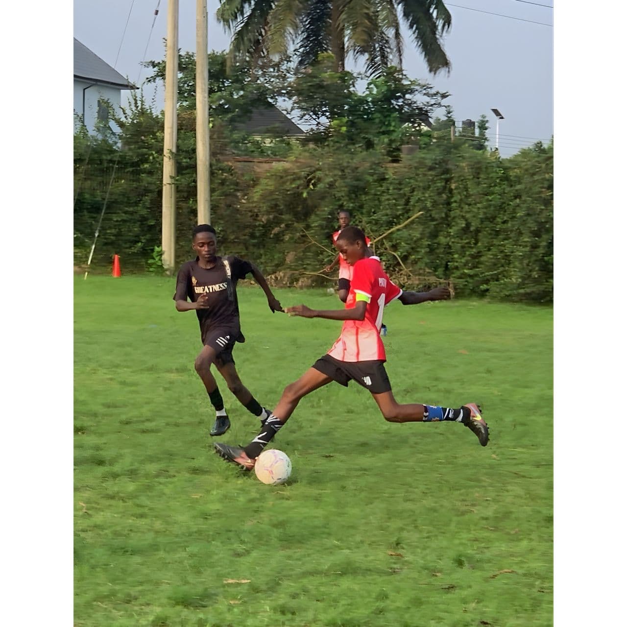 Two players battling for the ball