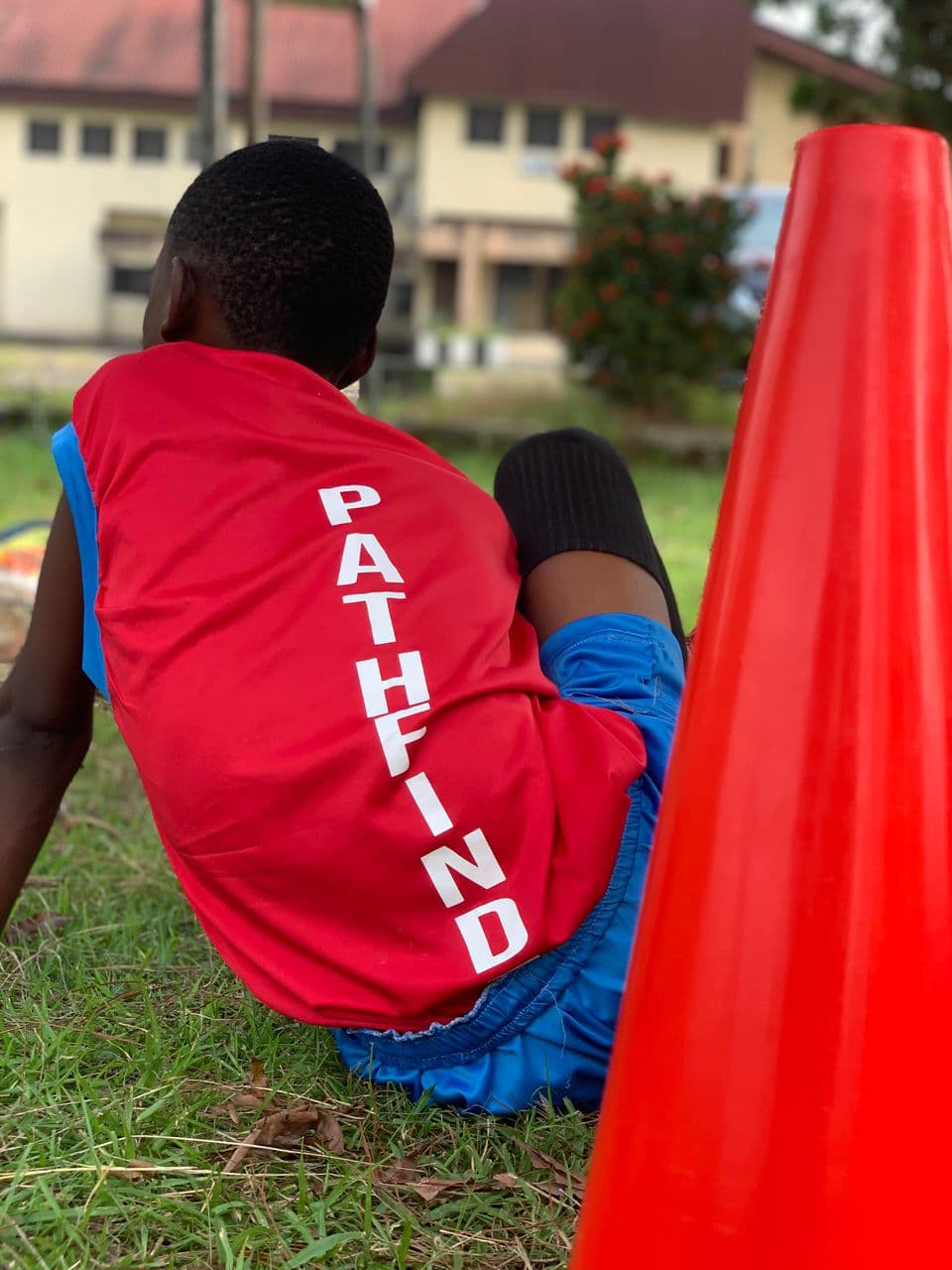 Player resting by training cone