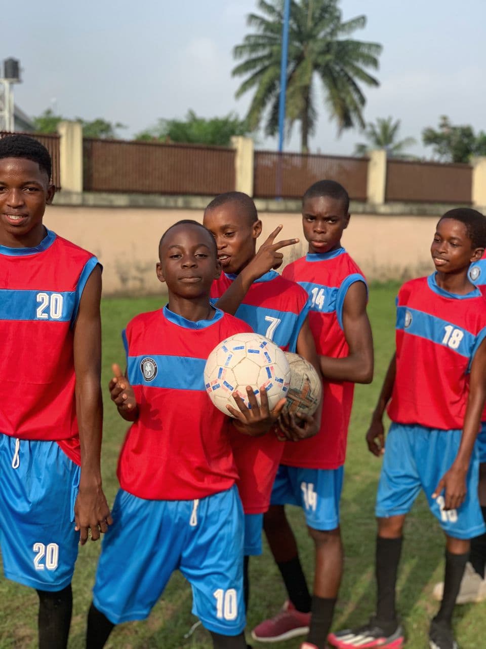 Players posing with football