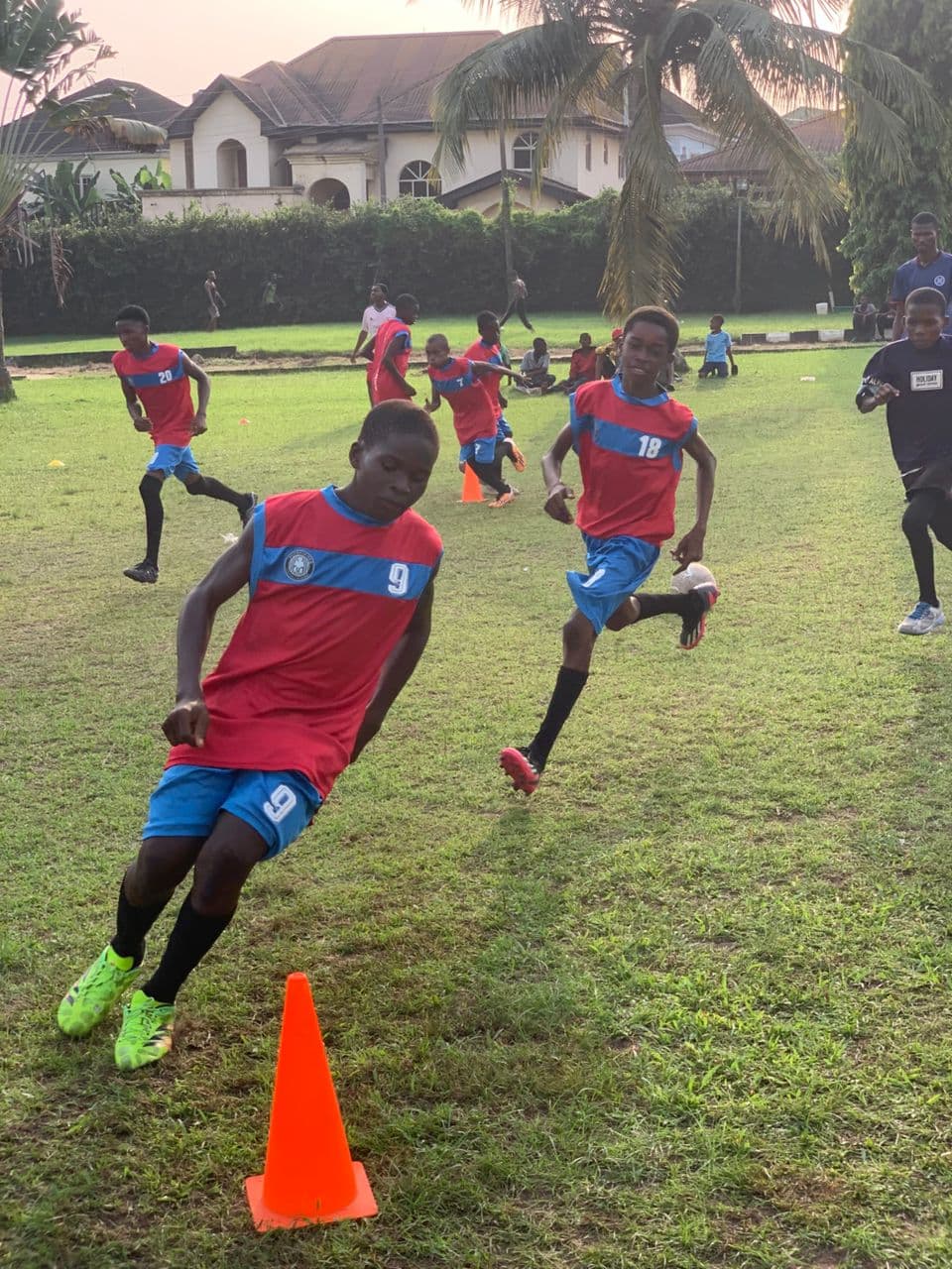 Players running cone drills