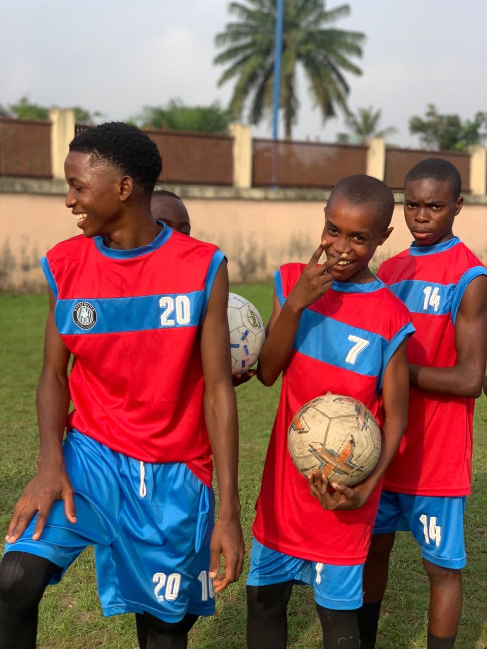 Players laughing together after training