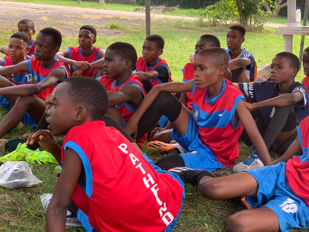 Team listening to coach briefing